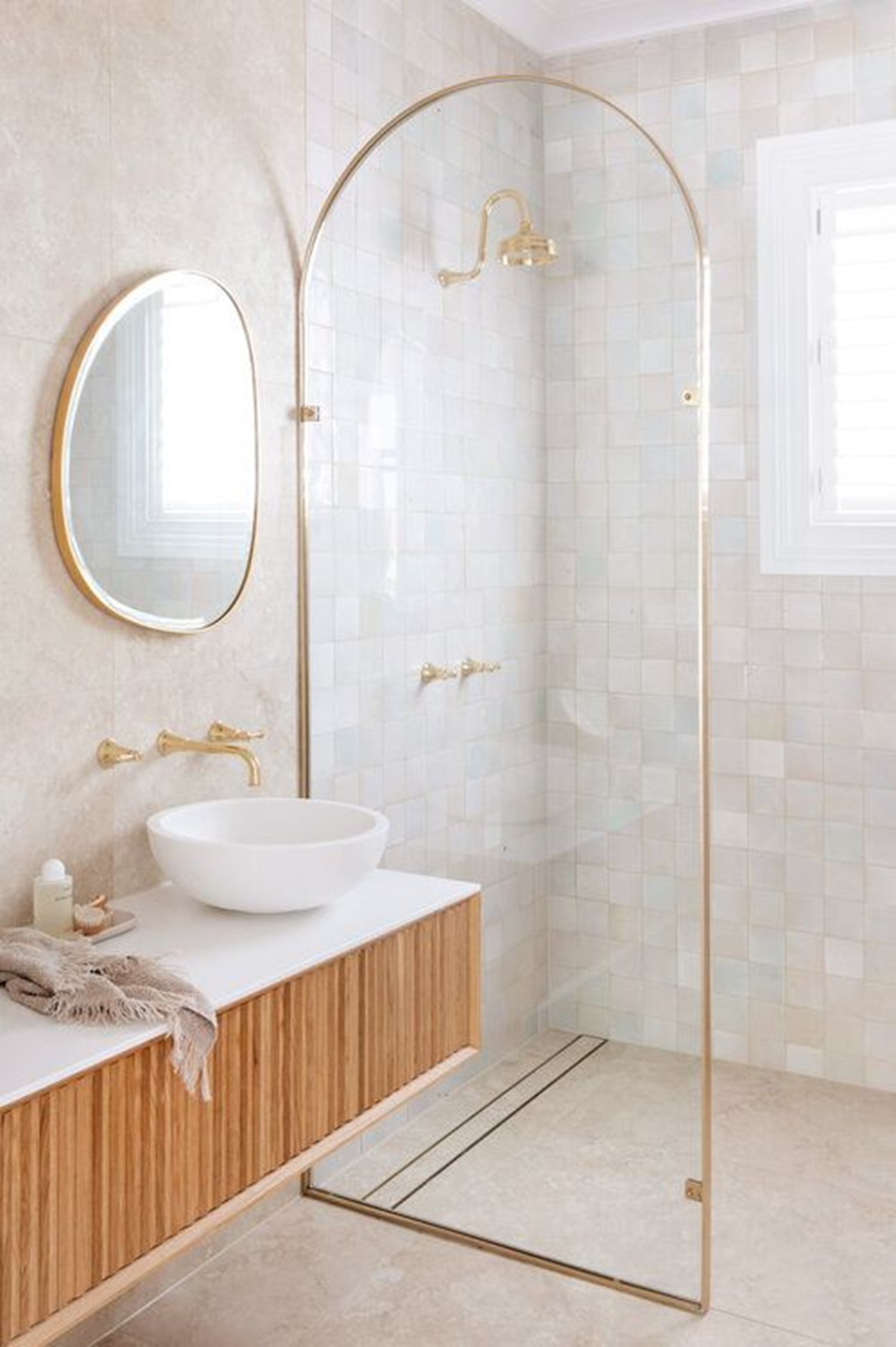 Luxury washroom featuring shower and sink