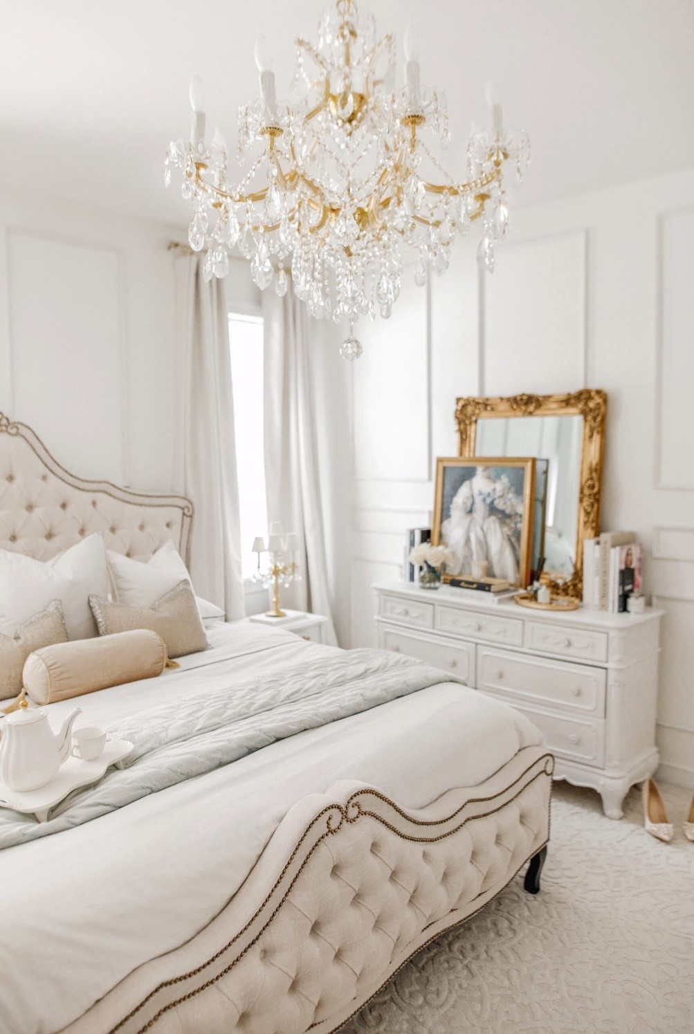 Parisian home interiors with dressing table and bed